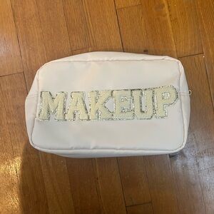Cream makeup bag
